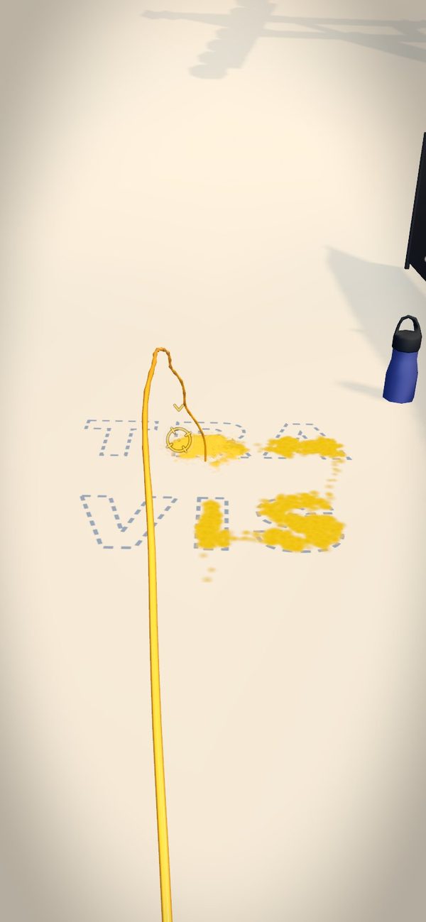 Fresh snow with the name TRAVIS outlined on two lines, partly written in yellow